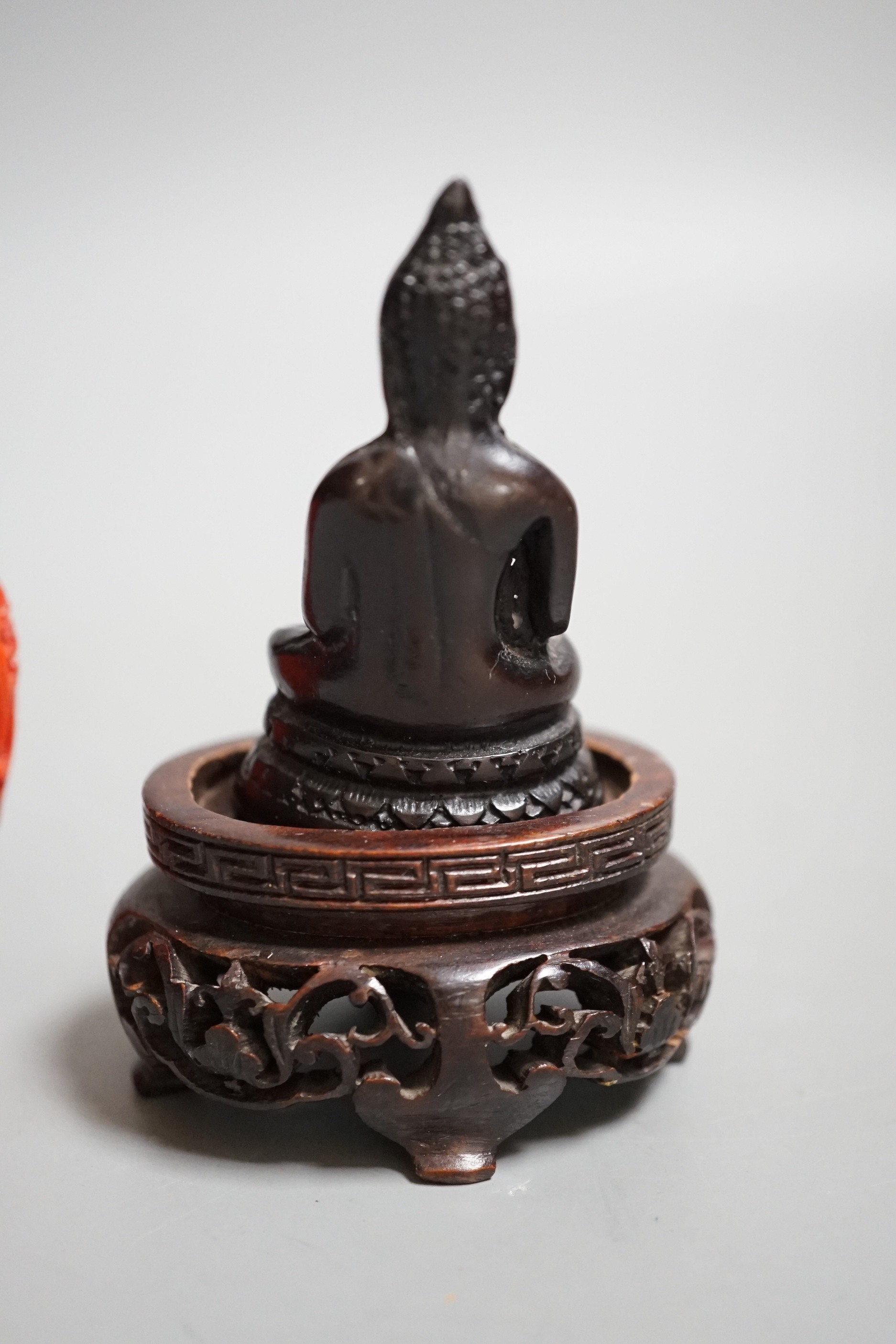 A Chinese resin snuff bottle, a resin Buddha on stand and a resin netsuke